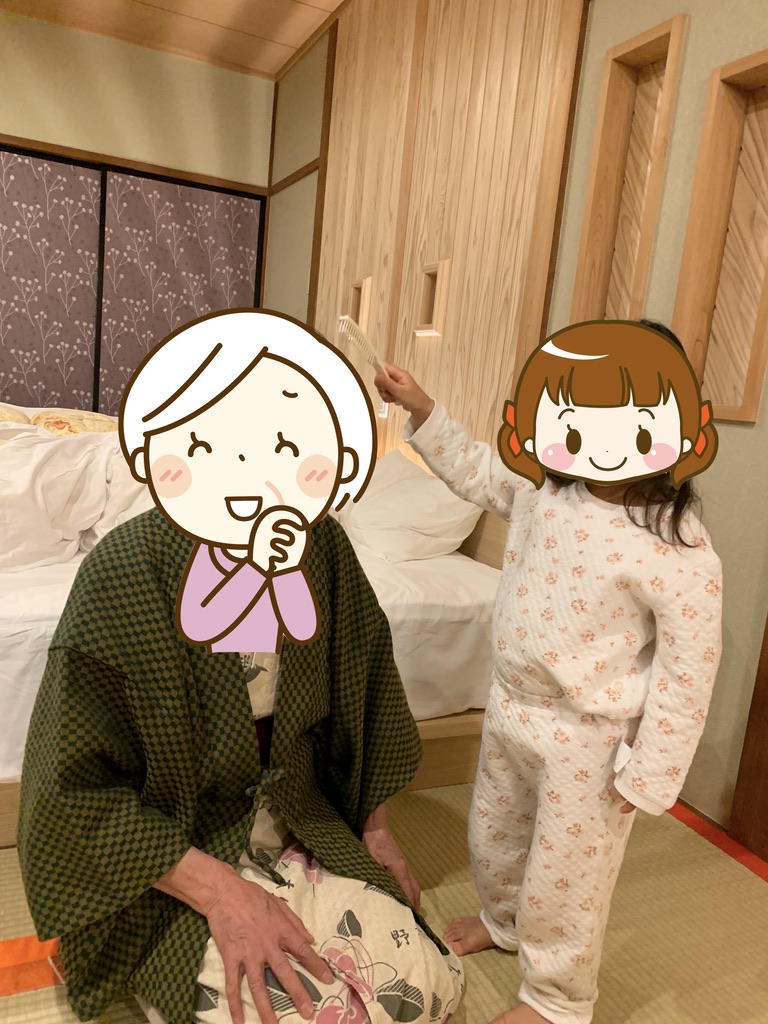 Grandmother spending time with her granddaughter in the Iwashajin guest room at Onogiso Ryokan, Umegashima Onsen, Shizuoka.