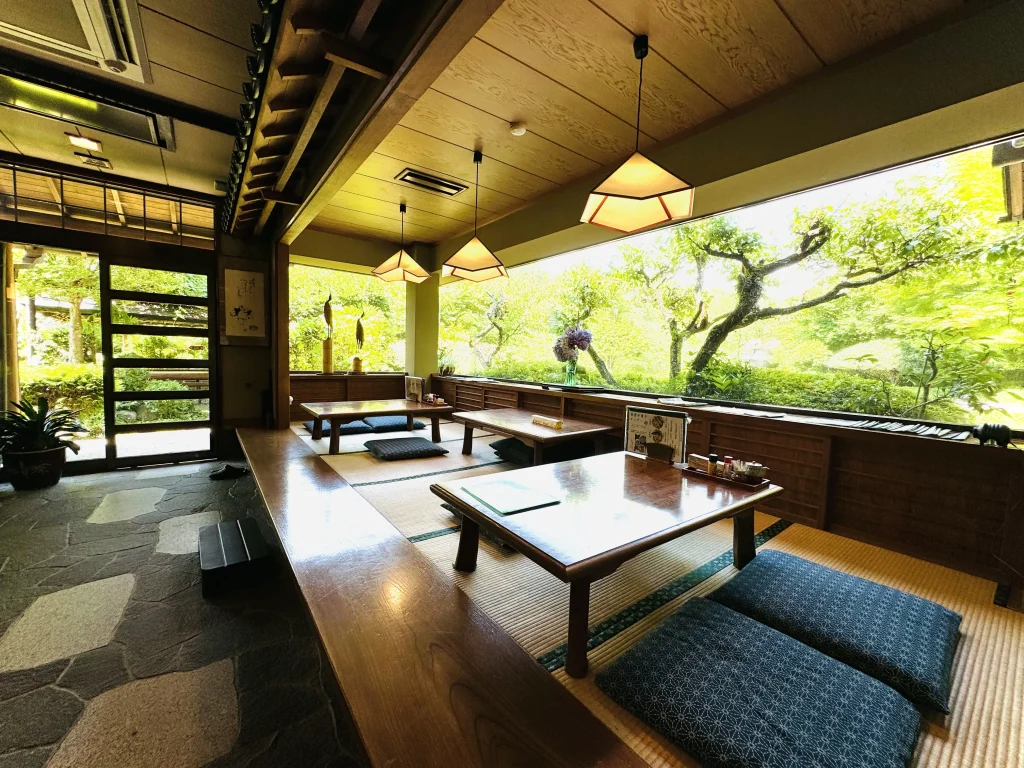 Tatami-style seating inside Genji Kamameshi Matsuba Chaya, offering a cozy and spacious dining area