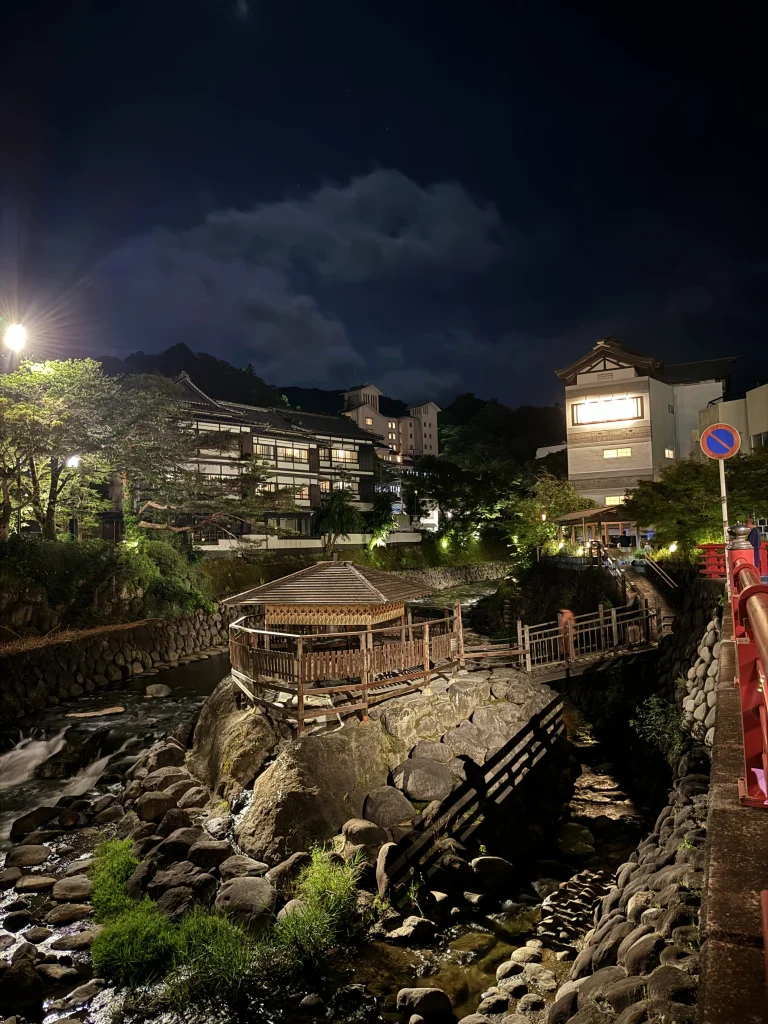 Tokko-no-Yu hot spring in Shuzenji Onsen illuminated at night, surrounded by the peaceful town atmosphere