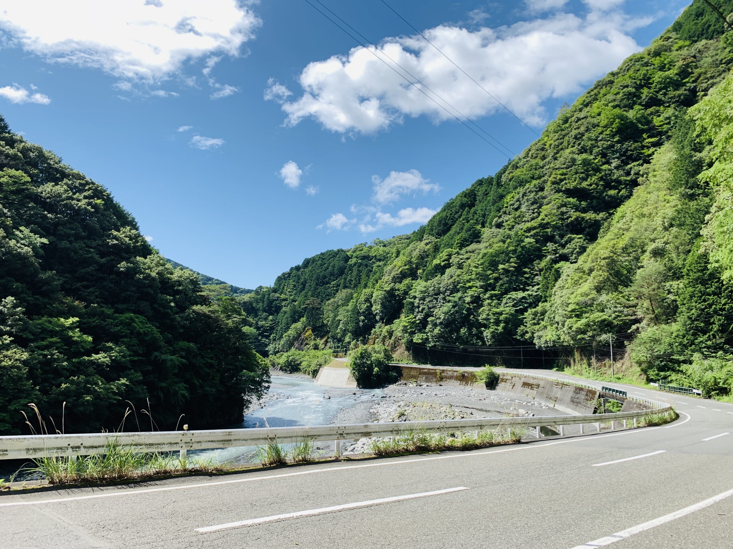 Scenic Abe Kaido Road surrounded by lush greenery leading to Umegashima Onsen, Shizuoka City