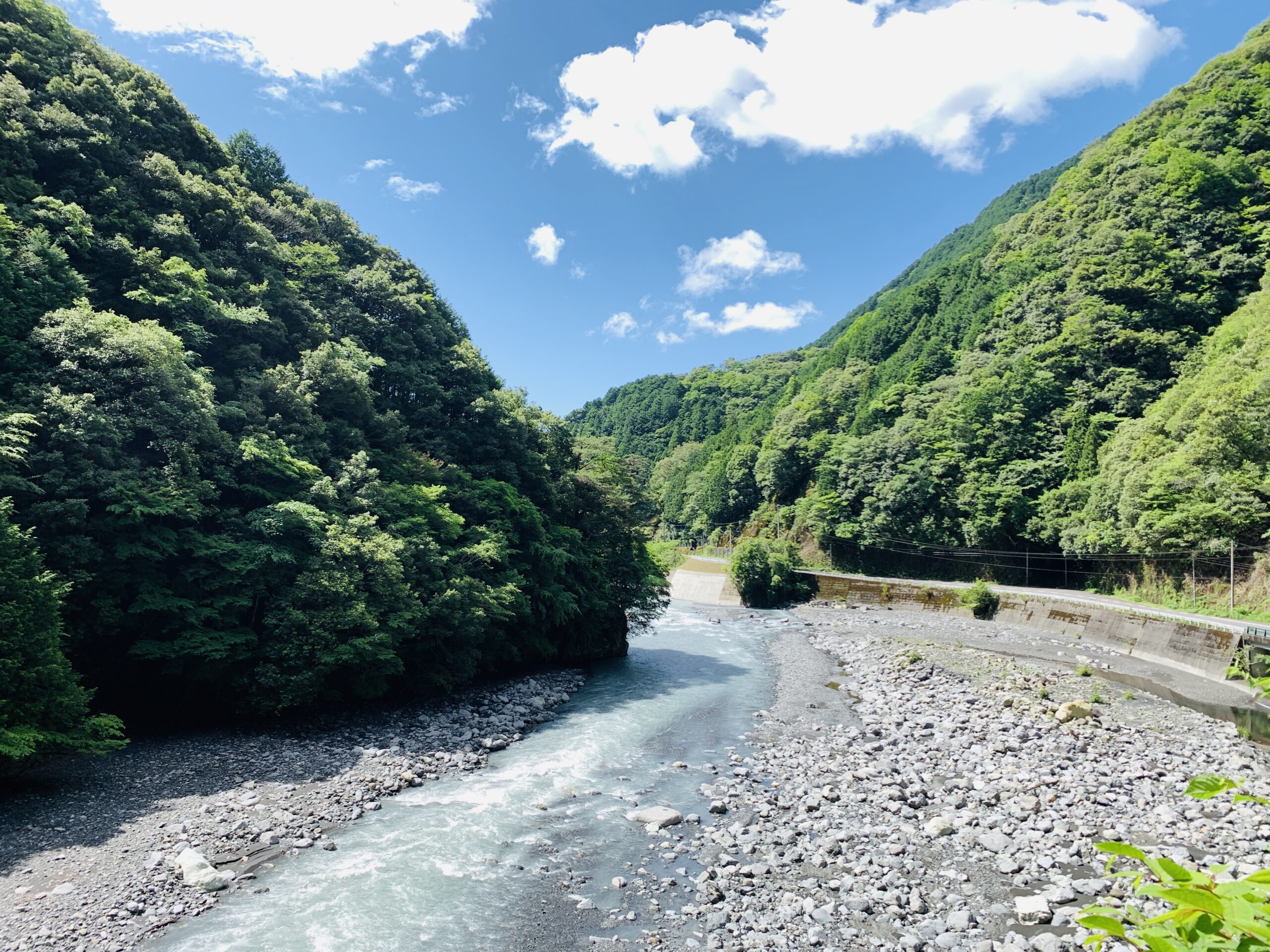 Scenic Abe Kaido Road surrounded by lush greenery leading to Umegashima Onsen, Shizuoka City