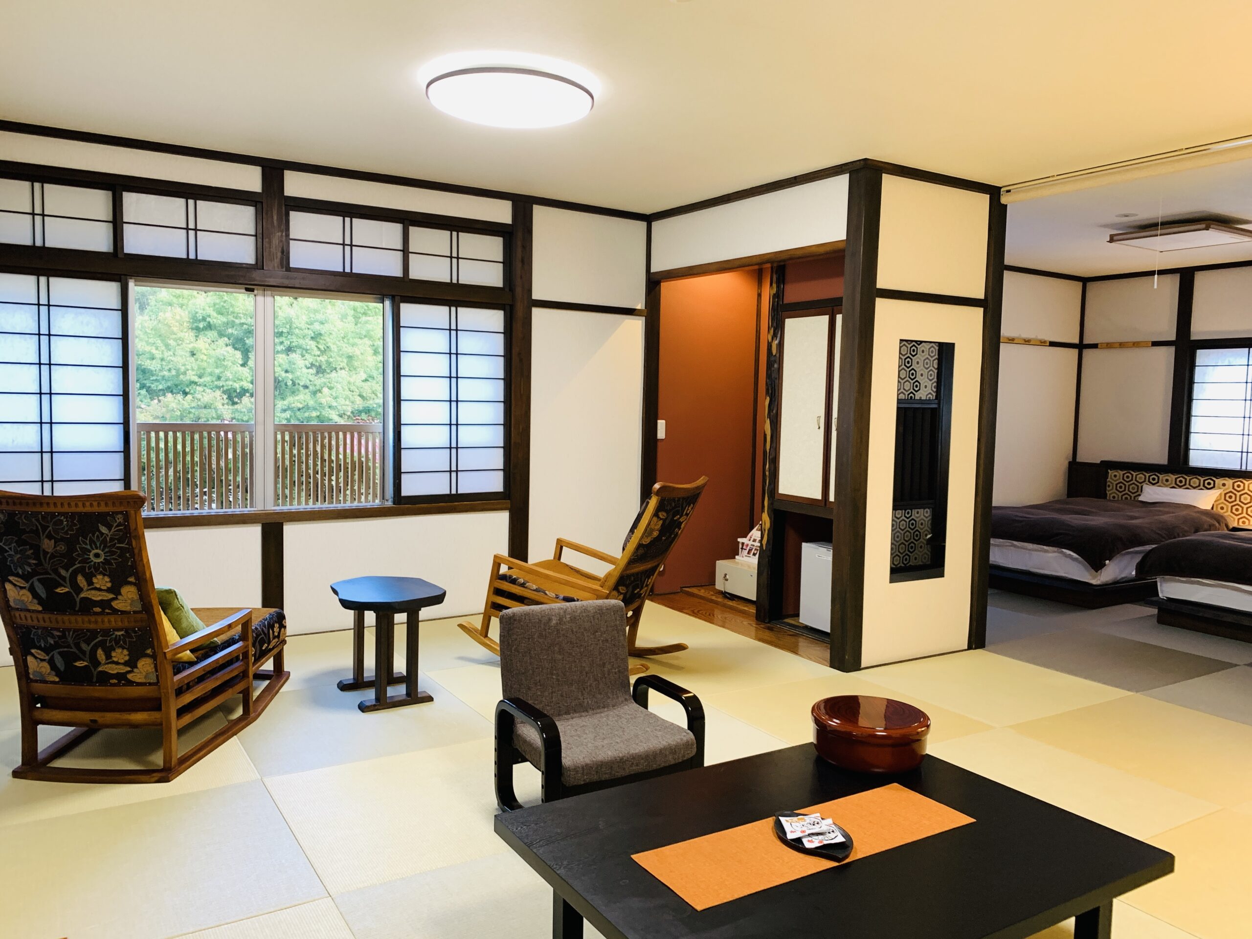 Jumaisan Room at Onogiso Ryokan, Umegashima Onsen – A spacious tatami room with mountain views