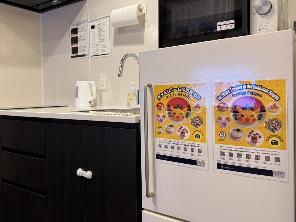 Guests checking out original Pokémon-themed recipes in the room by scanning a QR code with a smartphone.