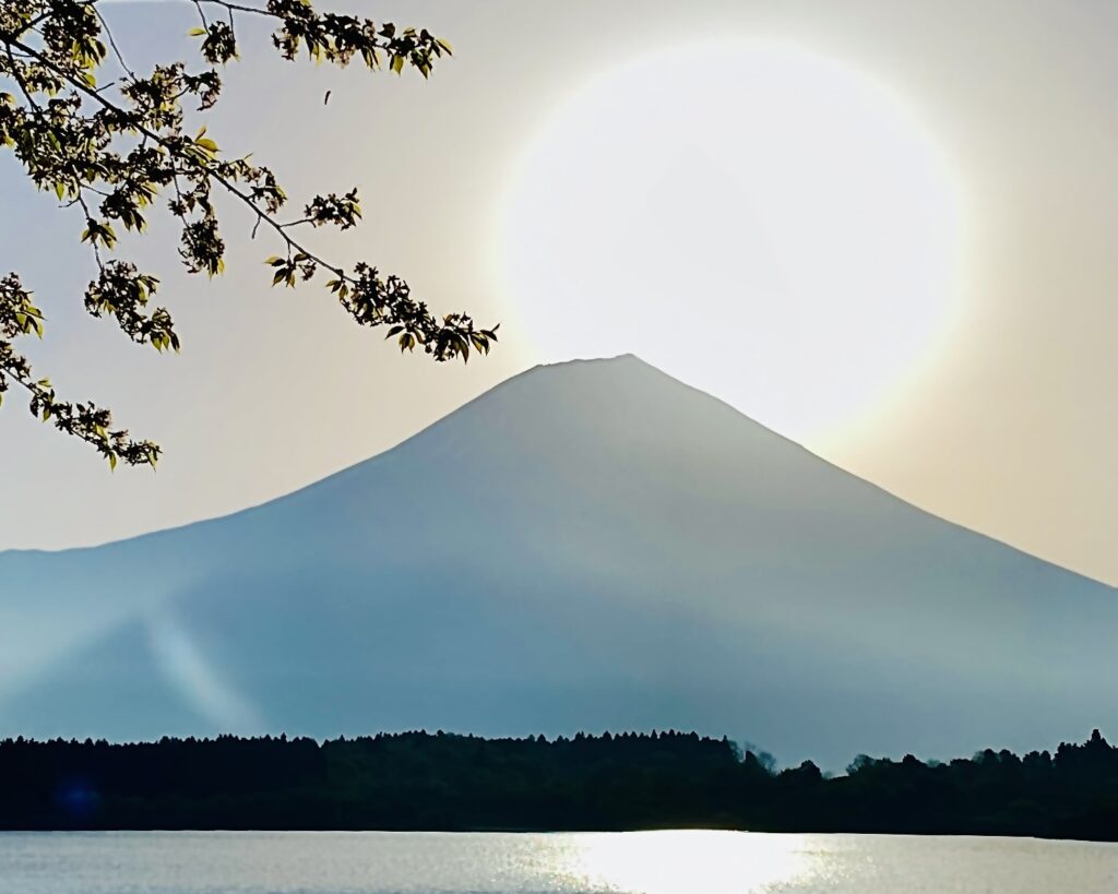 Diamond Fuji at Lake Tanuki with the sun rising directly above Mt. Fuji’s summit, captured on April 20, 2023.