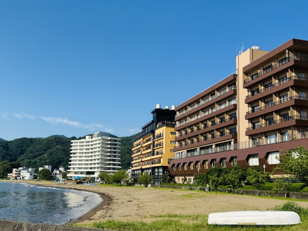 Coastal view of Toi Onsen with beach access in summer