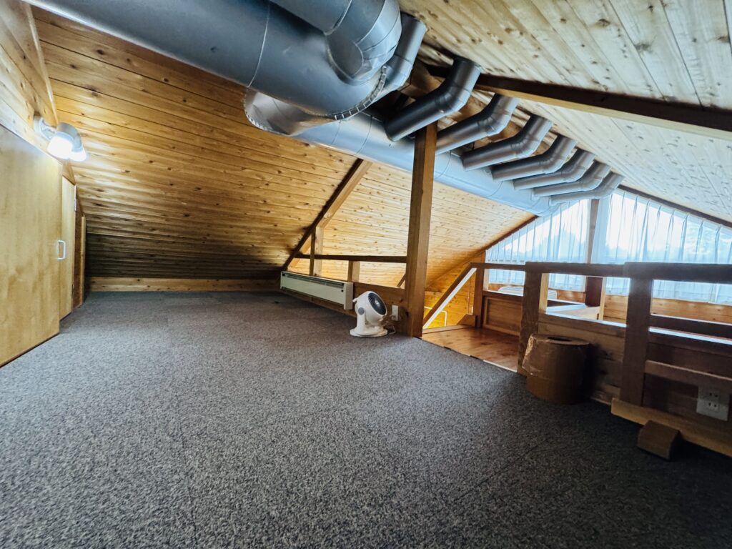 Loft area inside a Kyukamura Fuji cottage, resembling a cozy attic space ideal for children.