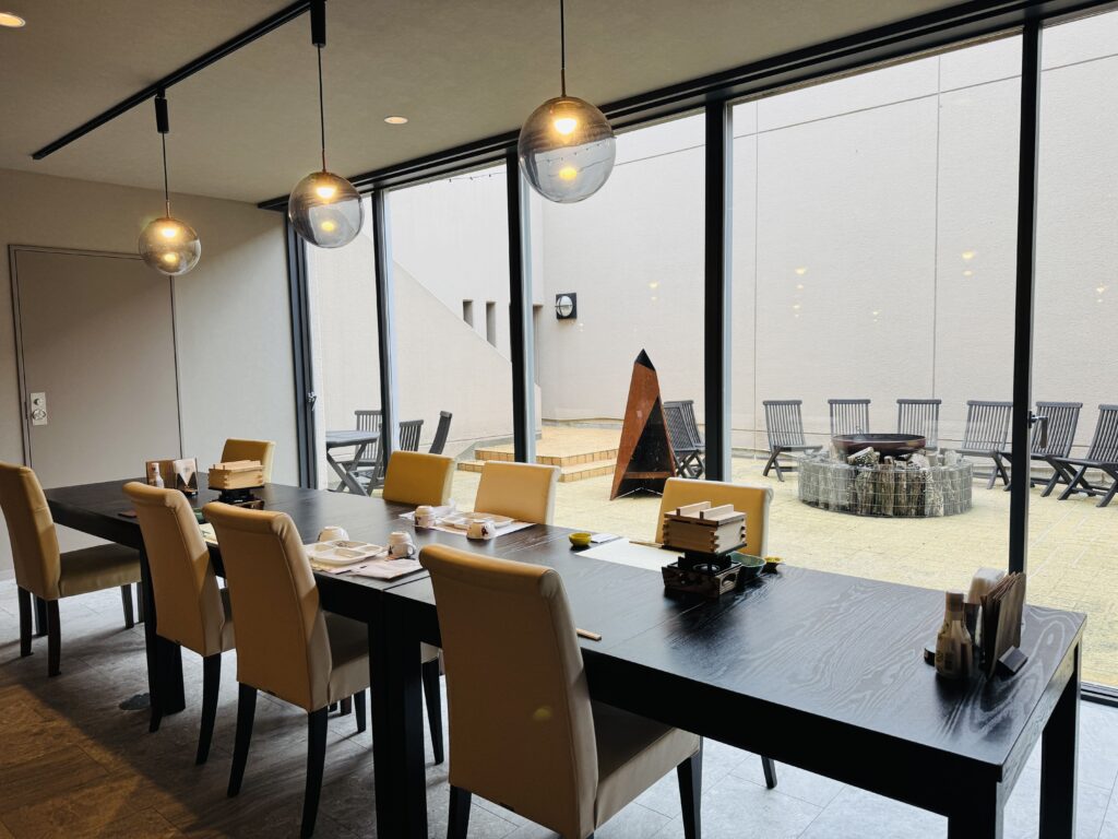 Table set for a group of six, including children, at the Kyukamura Fuji restaurant serving Suruga Kaiseki dinner.