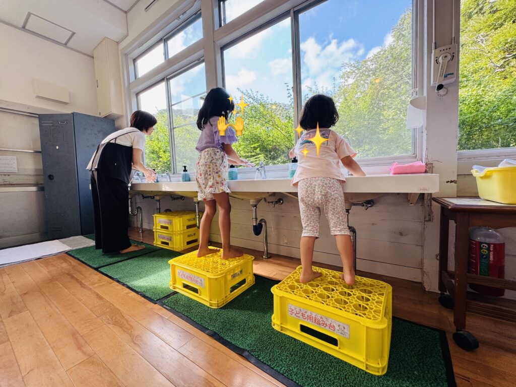 Shared sink area in the first-floor hallway of Yamabiko-so Inn in Nishi-Izu, right outside the former classrooms