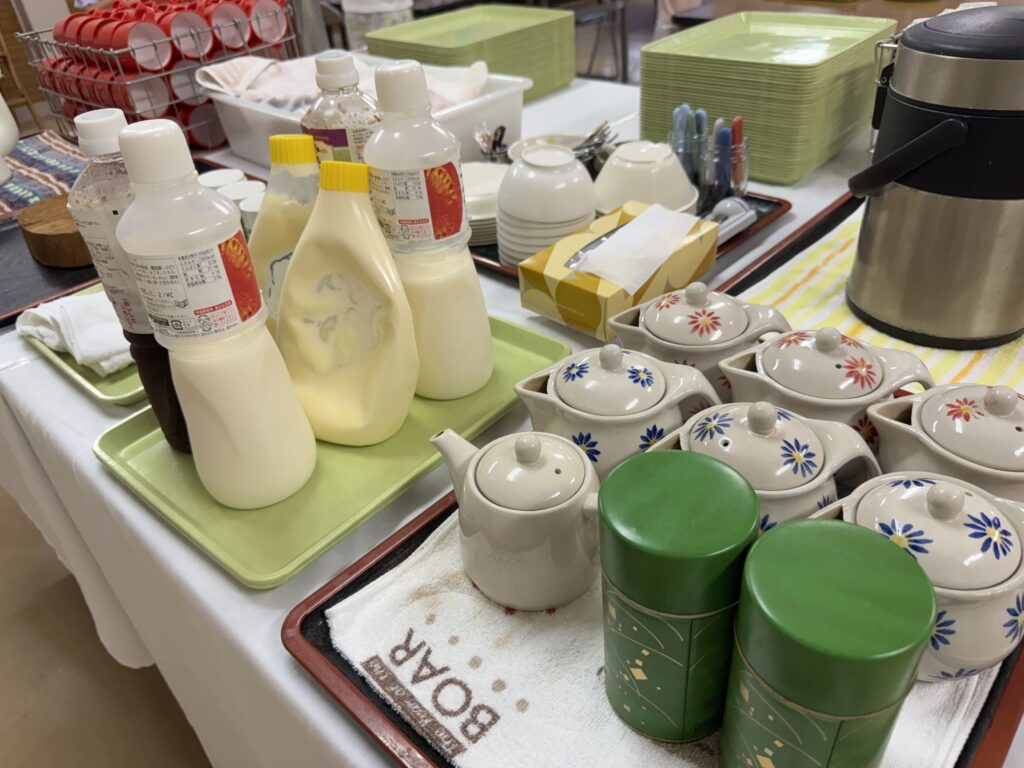 Self-service tea, condiments, and dressings in the dining hall at Yamabiko-so Inn in Nishi-Izu
