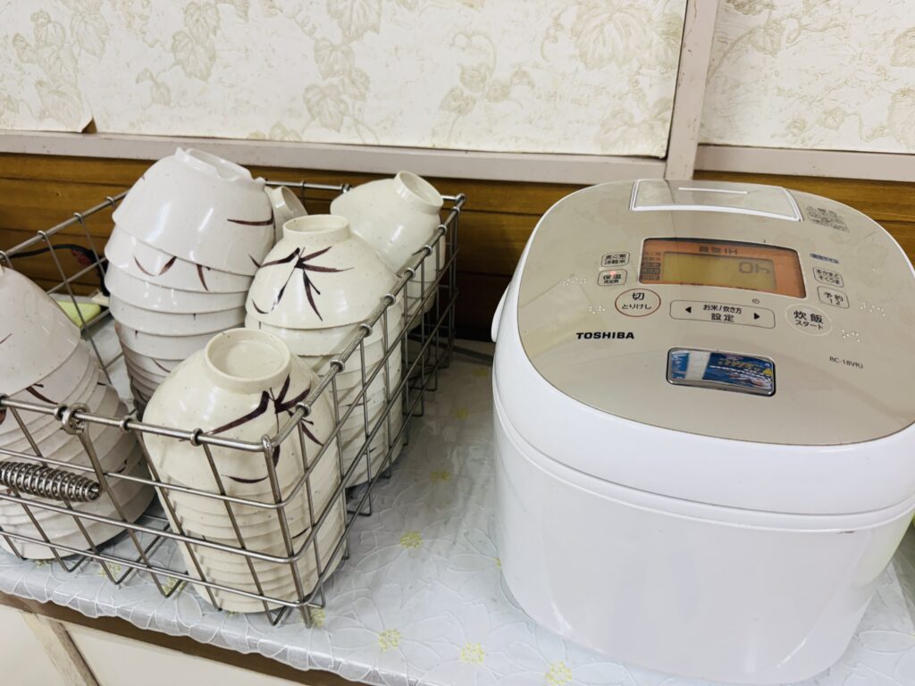 Large self-service rice cooker in the dining hall at Yamabiko-so Inn in Nishi-Izu