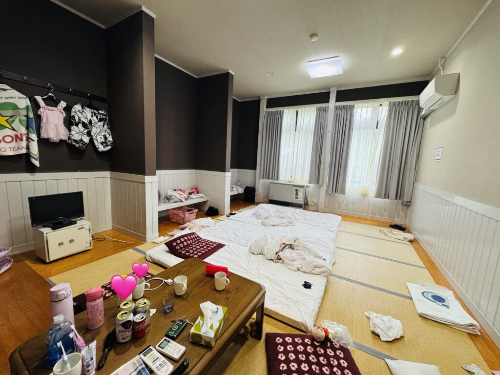 Interior of the “Class 1-1” guest room at Yamabiko-so Inn in Nishi-Izu, with futon bedding laid out on tatami mats