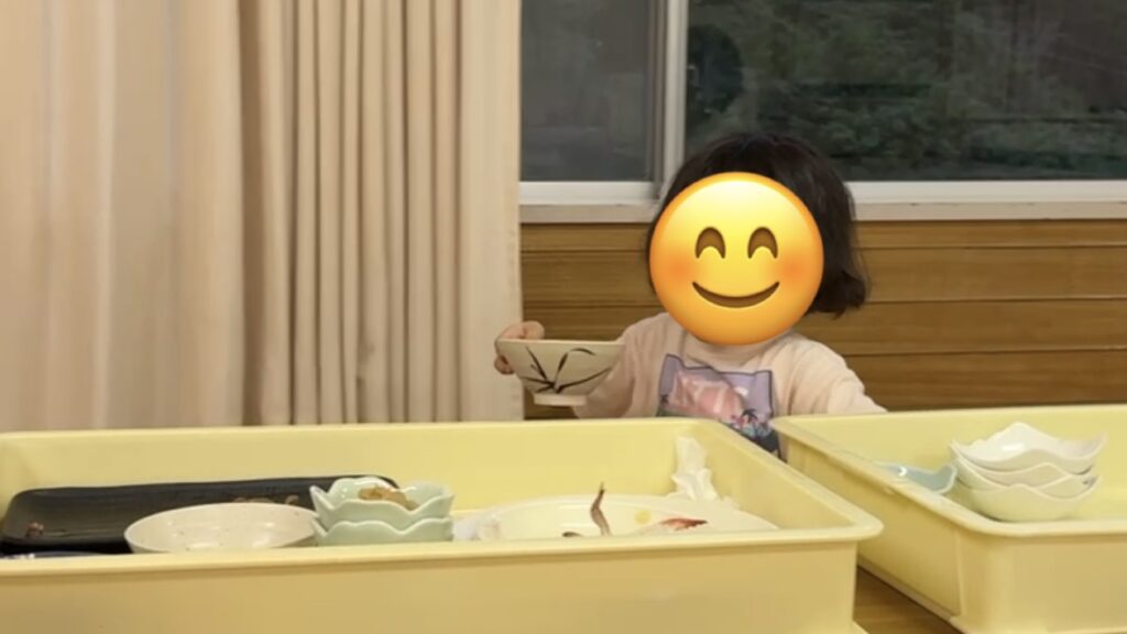 In the dining hall at Yamabiko-so Inn in Nishi-Izu, my 3-year-old daughter helping to clear the dishes after a meal