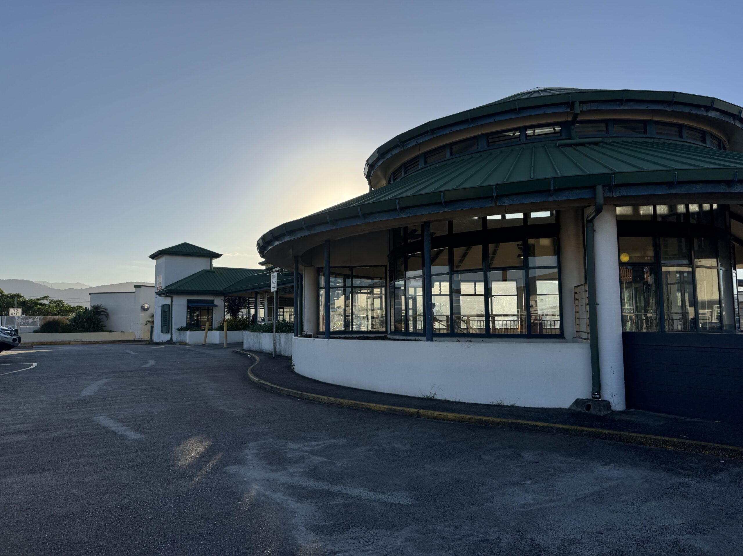 Walking through the Cairns Central food court area toward the Kuranda Scenic Railway station, a route that can be hard to spot due to limited signage.