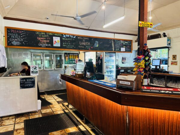 The taproom at Kuranda Hotel, featuring a bar counter where visitors can enjoy local craft beers.