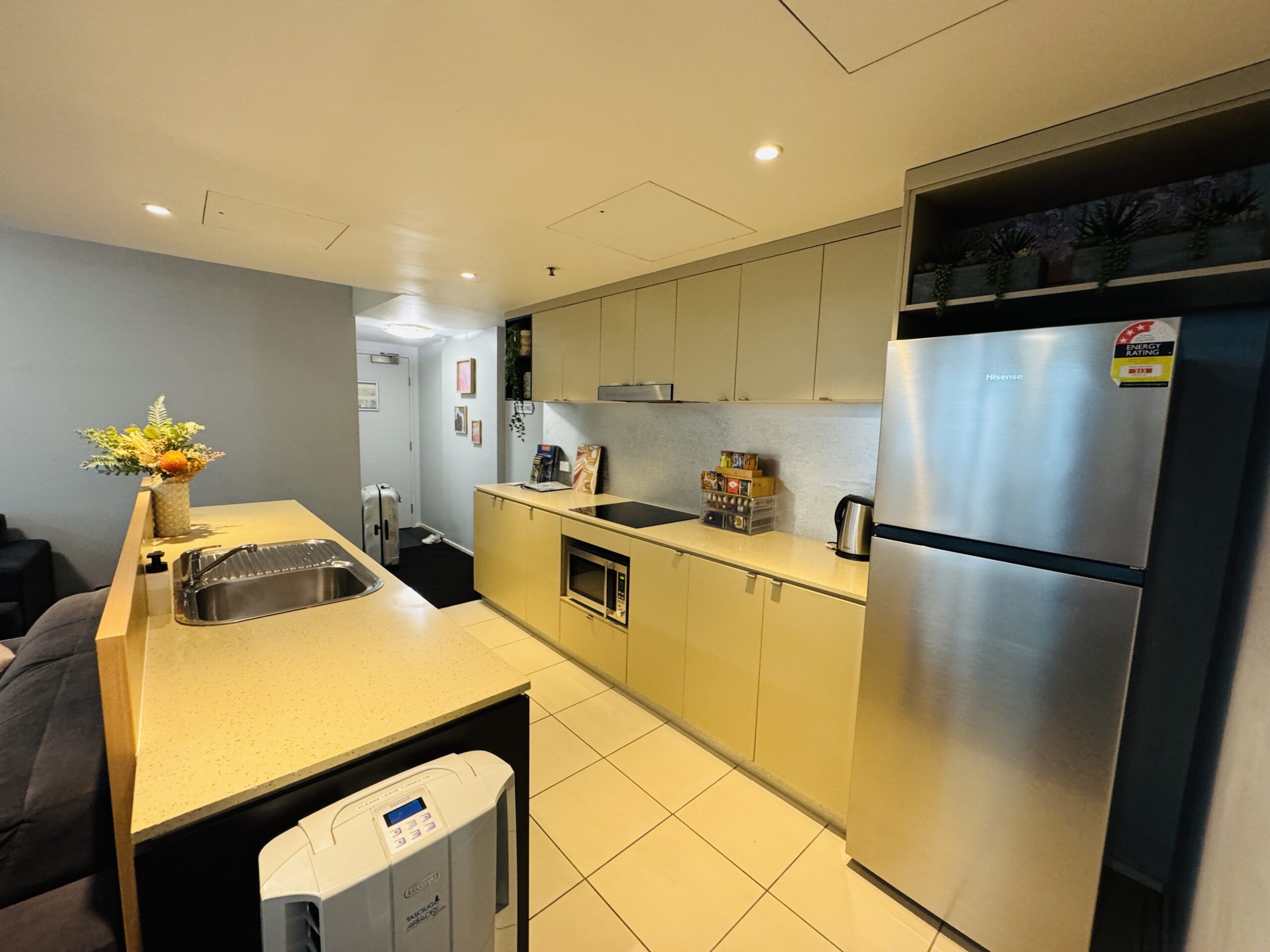 Kitchen and refrigerator in a guest room at Cairns Reefside Retreat