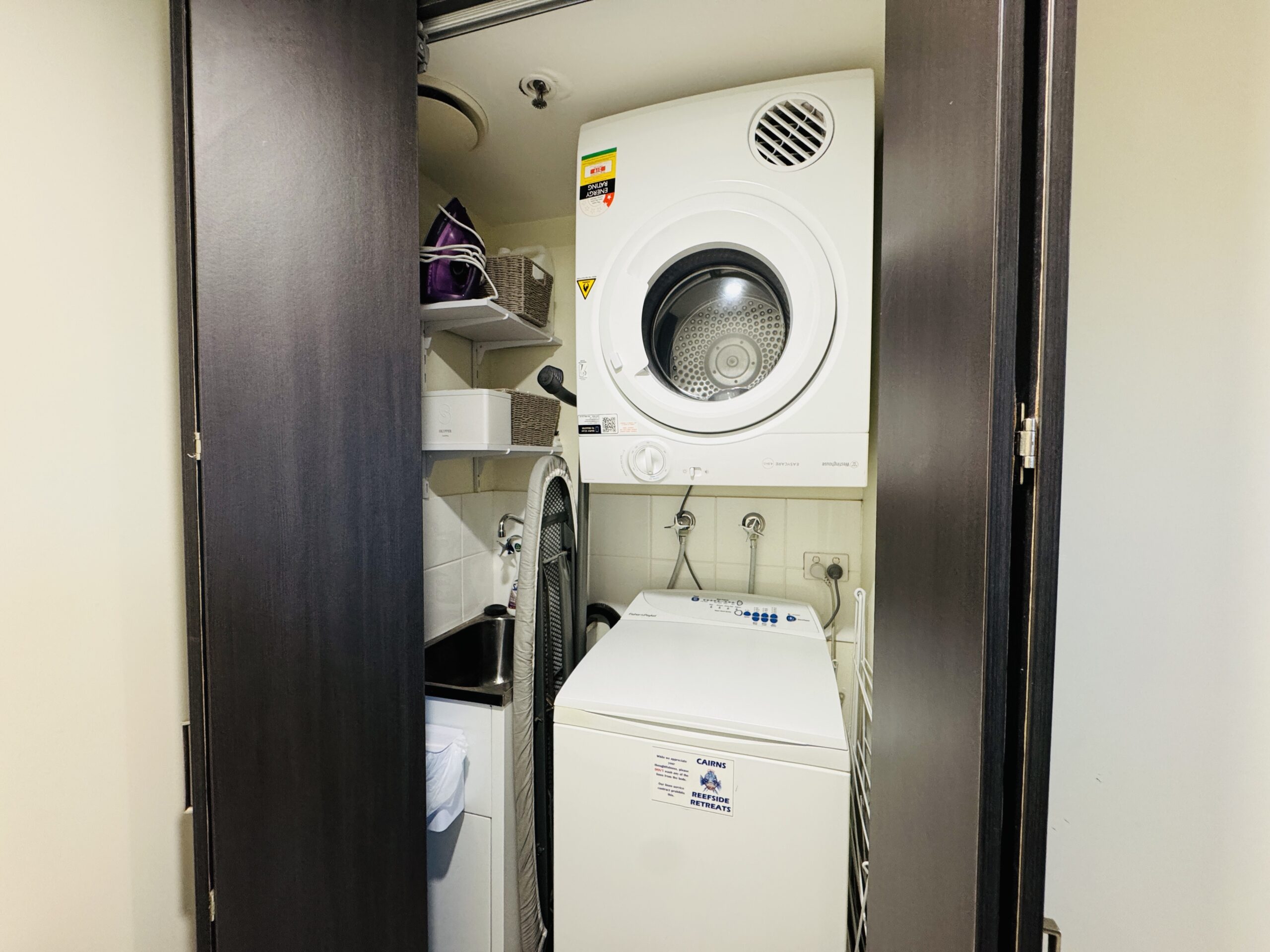 Washer and dryer located inside the guest room at Cairns Reefside Retreat