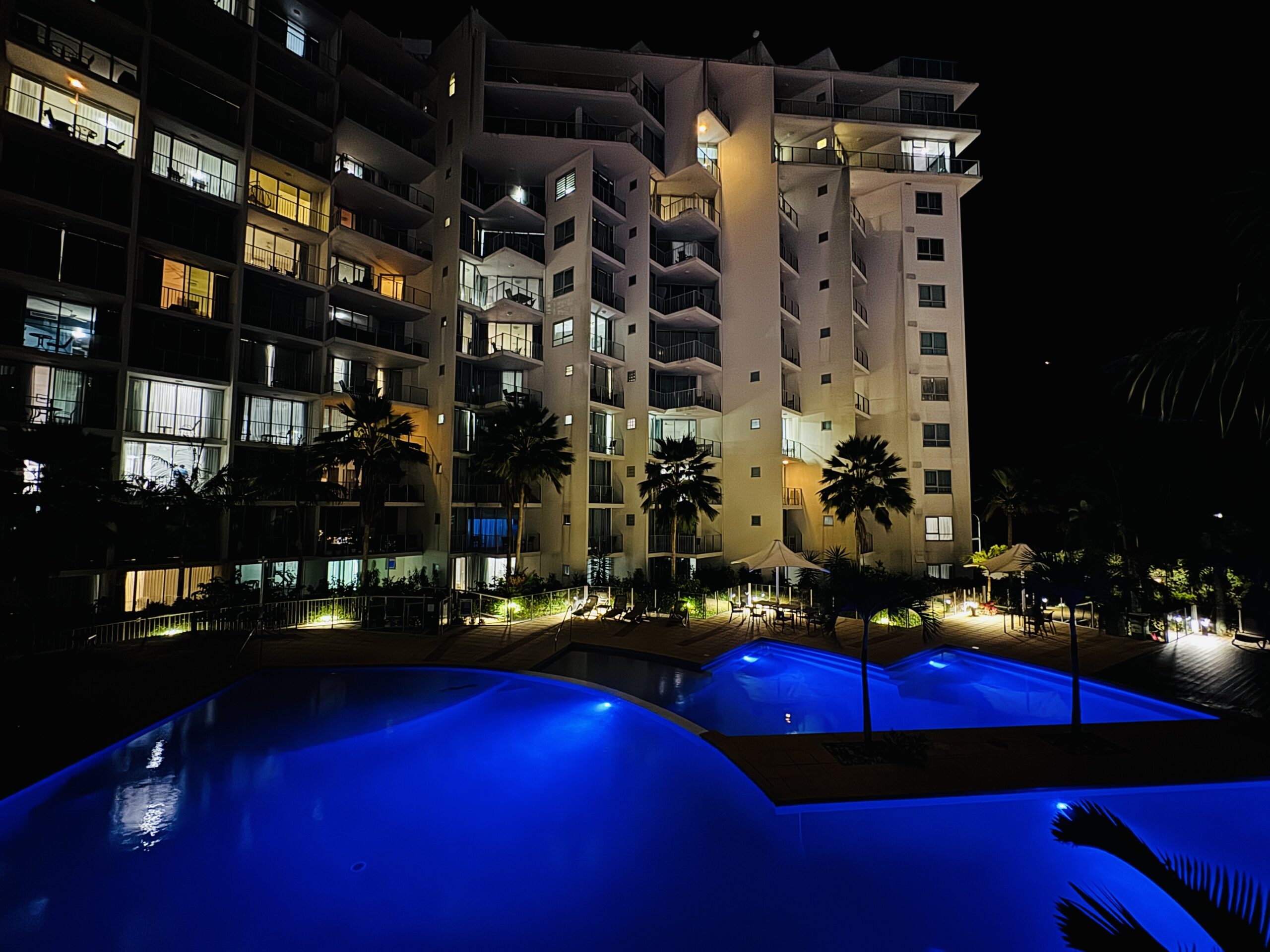 Night view from the balcony at Cairns Reefside Retreat, with the pool illuminated